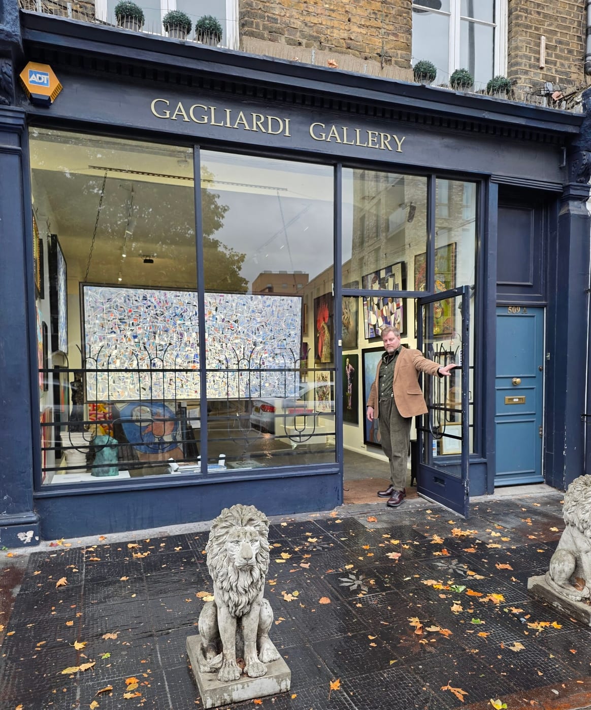 Interior of Gagliardi Gallery on the King's Road, with original paintings hung salon-style across the gallery walls