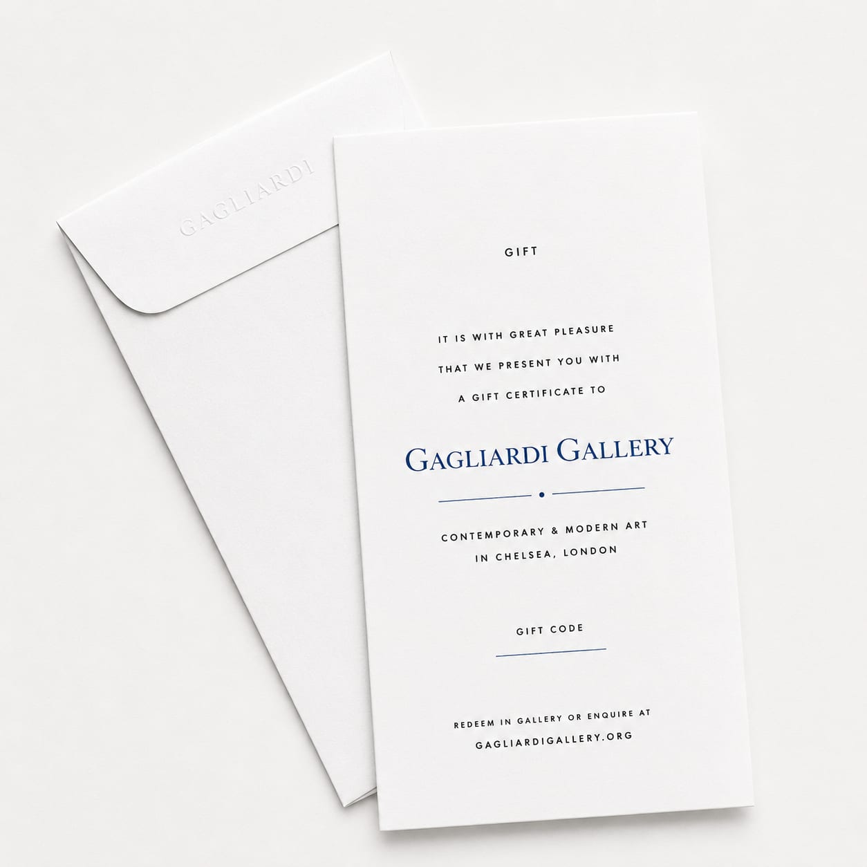 A Gagliardi Gallery printed gift certificate resting on an embossed envelope, reading 'It is with great pleasure that we present you with a gift certificate to Gagliardi Gallery, contemporary and modern art in Chelsea, London', with a space for a gift code